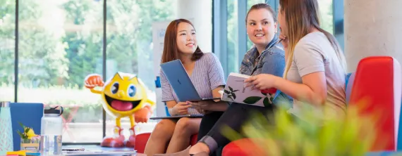 students sitting and talking in the lobby