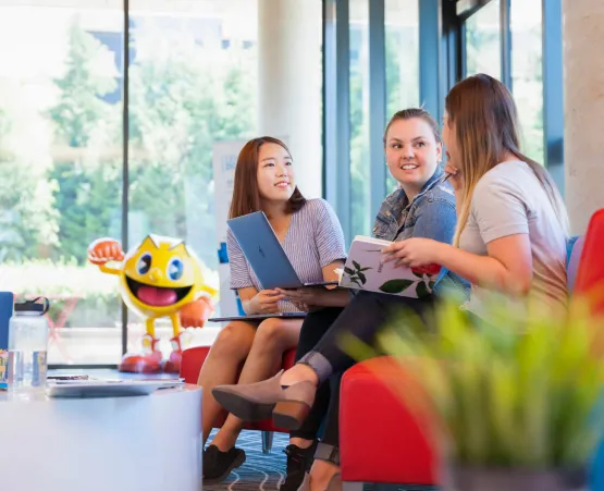 students sitting and talking in the lobby 